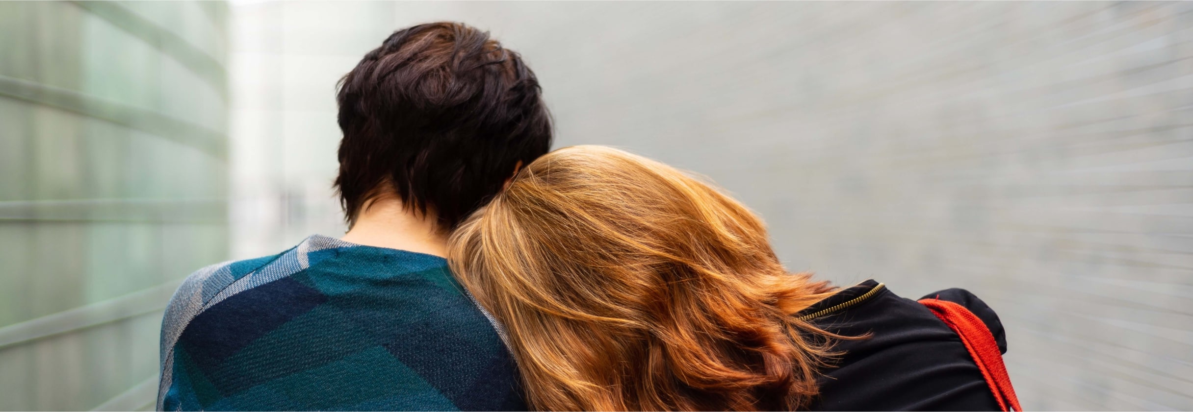 A man and woman facing each other.