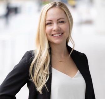 A woman smiling at the camera.